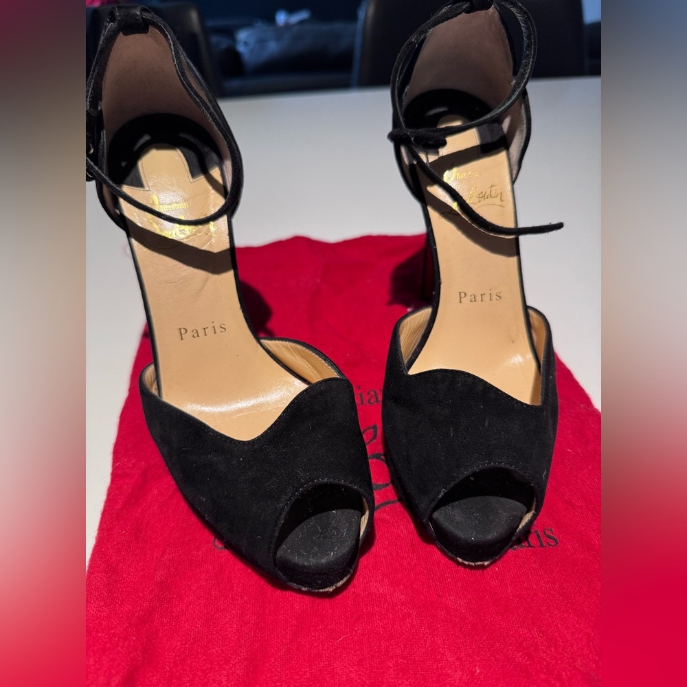 Christian Louboutin peep toe high heels.